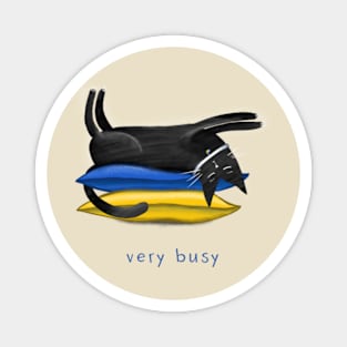 Cartoon black cat on soft pillows and the inscription "Very busy" Magnet